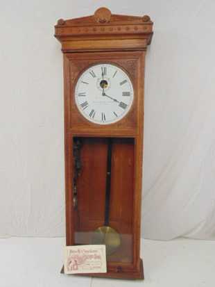 Self Winding clock Company oak wall clock, with